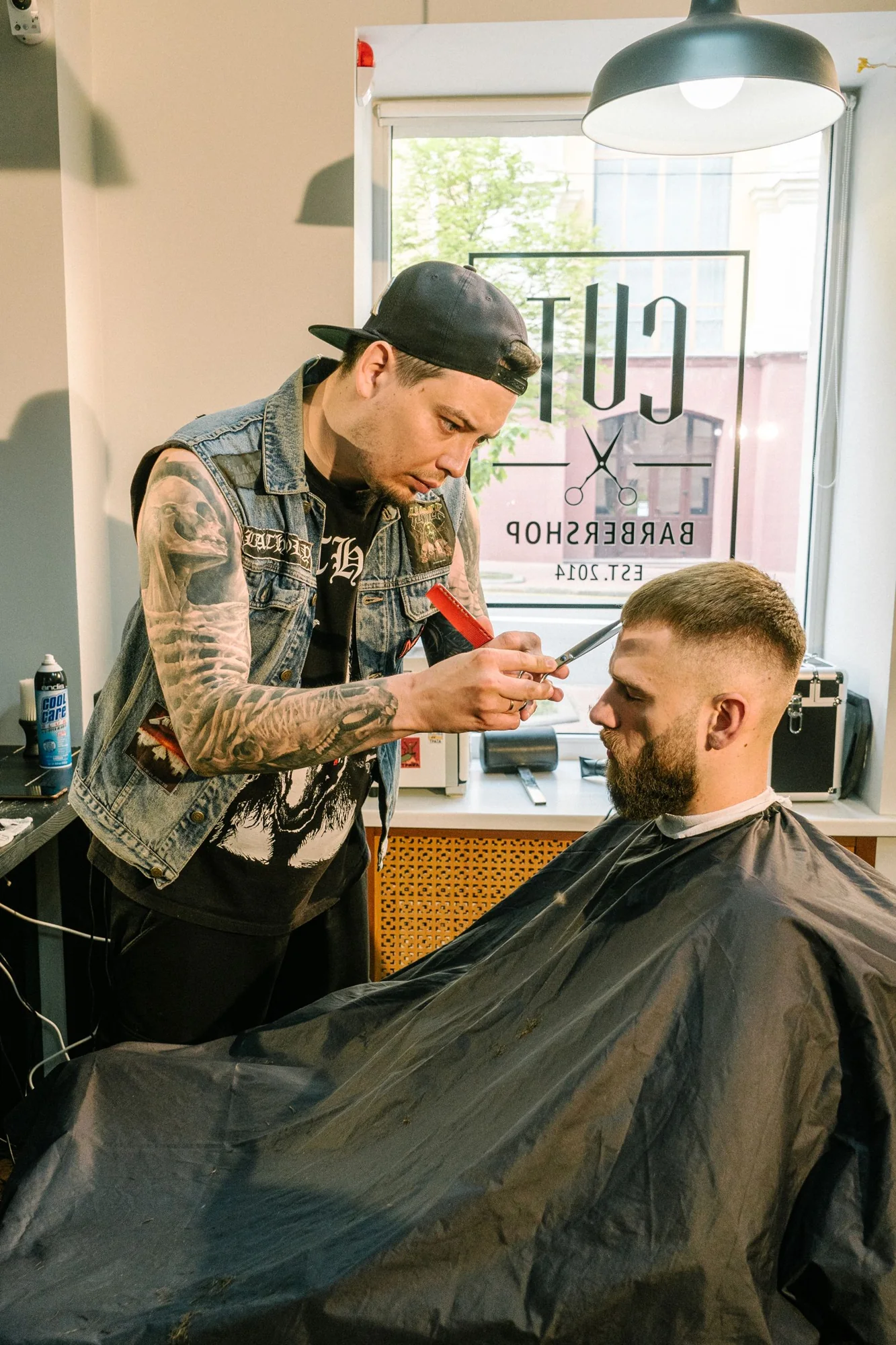Barber performing detailed beard grooming